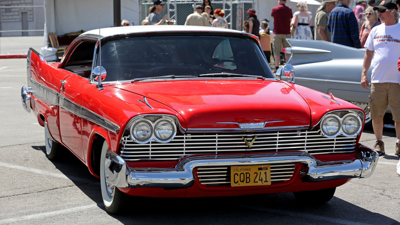 Red 1958 Plymouth Fury parked