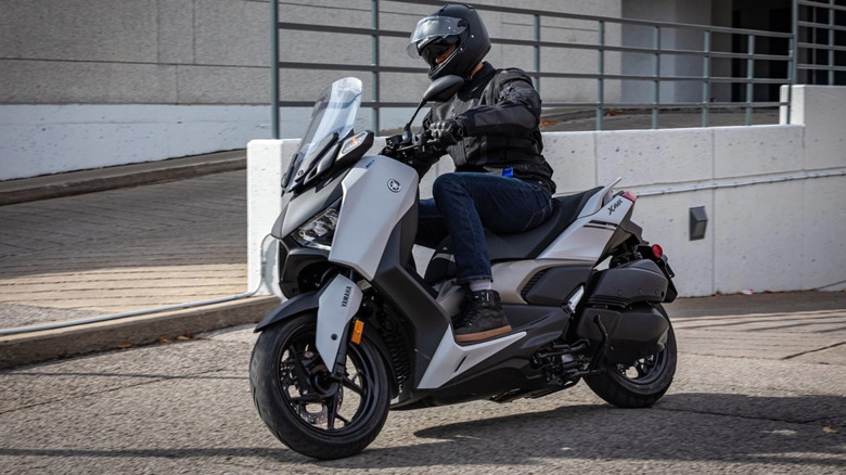 person riding yamaha vmax scooter