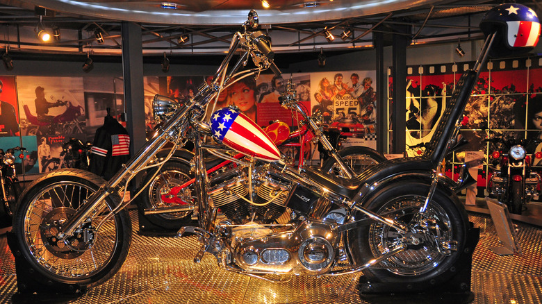 Easy Rider Captain America chopper on display in museum with film posters and photos