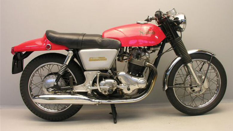 Red 1969 Norton Commando motorcycle parked indoors