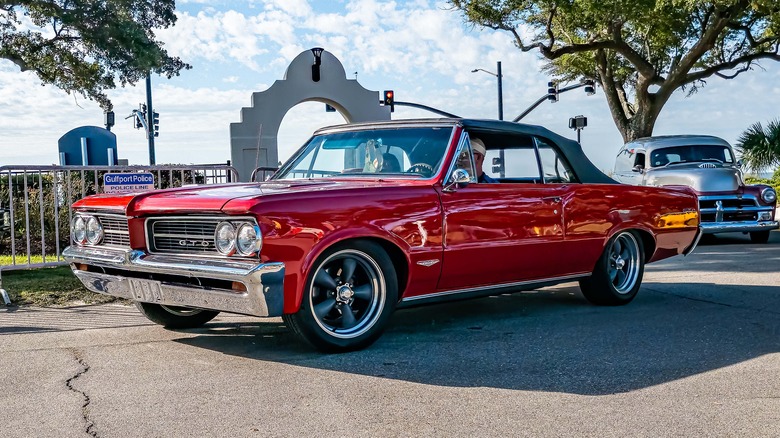 Red 1964 Pontiac GTO parked