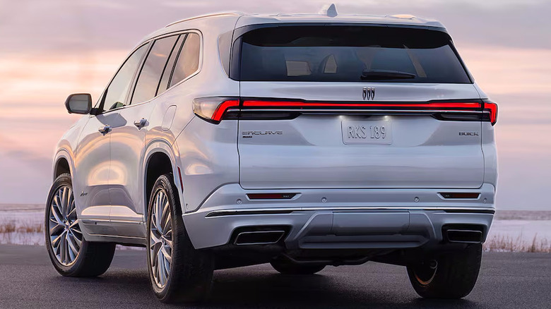 White Buick Enclave Avenir parked near water