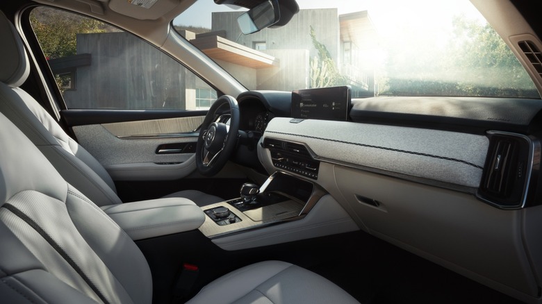 Mazda CX-90 interior showing dashboard and driver controls