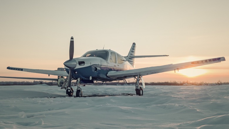 Piper Cherokee parked in a field