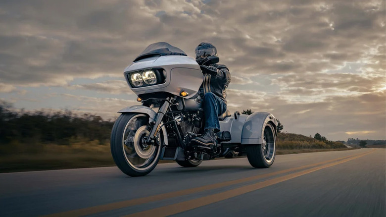 person riding harley-davidson road glide 3