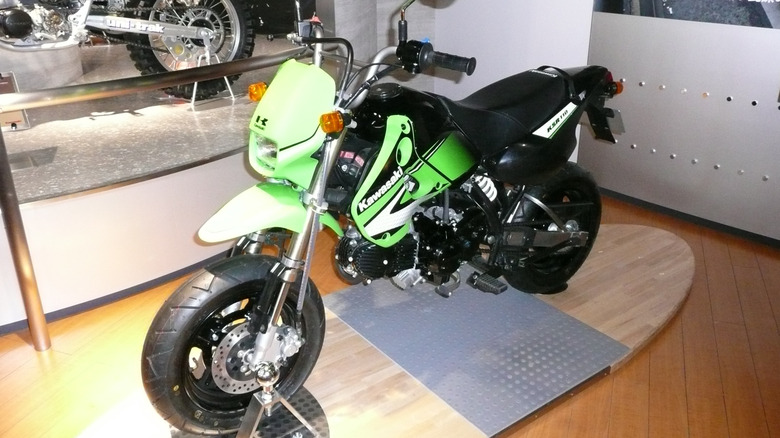 Kawasaki KSR110 parked in a showroom display