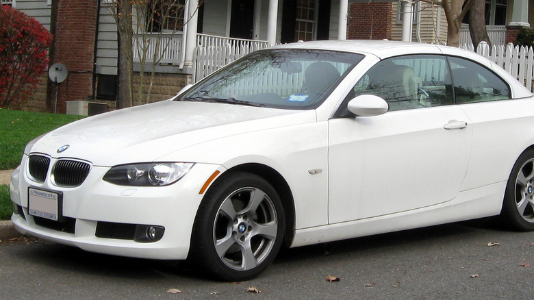 2011 BMW 3 Series parked in neighborhood 