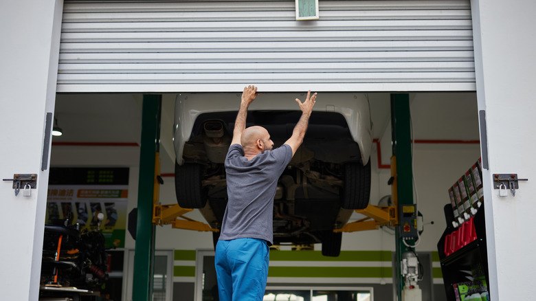 person opening garage door 