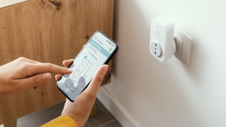 Woman setting up smart plug