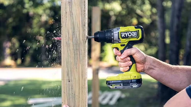 Ryobi cordless driver drilling through a piece of wood