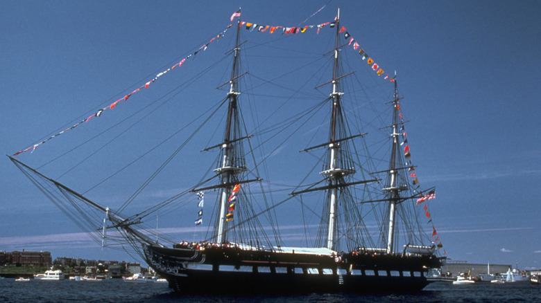 USS Constitution afloat flying flags