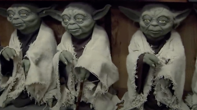 Yoda prototypes standing in a line on shop shelf