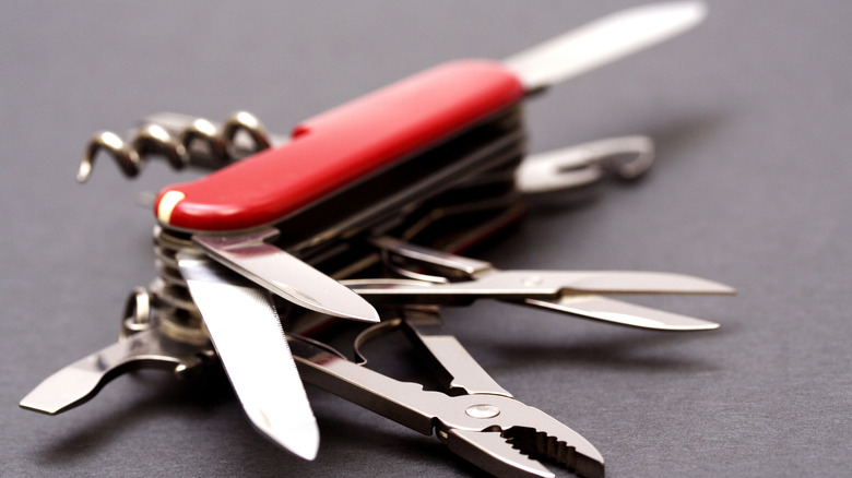 open swiss army knife lying on table