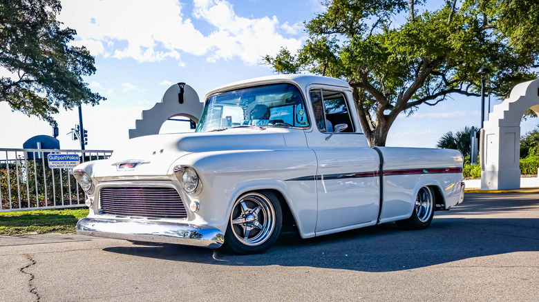 White low-rider pickup parked at Gulfport