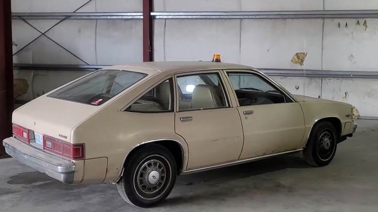 1981 Chevy Citation in Light Brown Inside A Garage