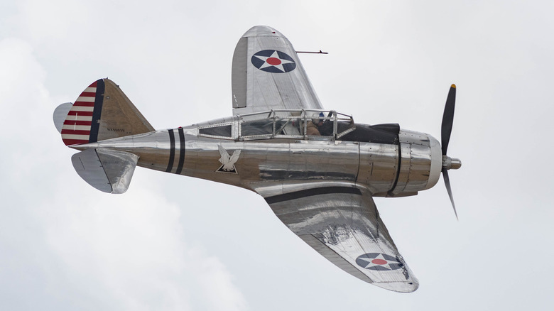 A Seversky P-35 flying over cloudy skies