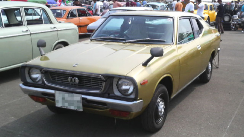 Datsun F-10 parked outdoors at auto show