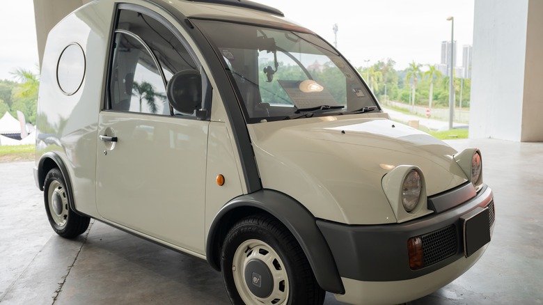 white Nissan S-Cargo parked in open garage