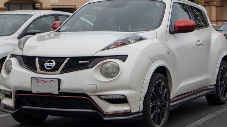 A 2013 Nissan Juke in a parking lot.