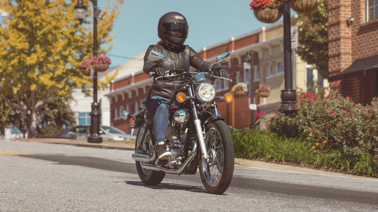 A black Yamaha V Star 250 being ridden on the street