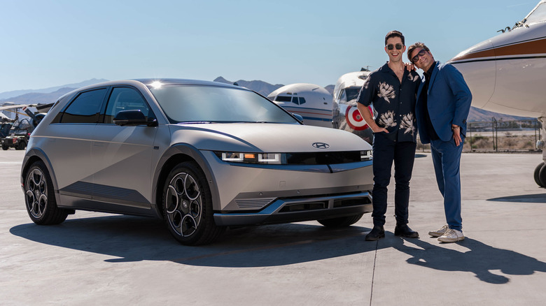 Josh Peck and John Stamos with Disney100 Ioniq 5