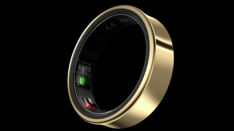 A gold Samsung Galaxy Ring shown against a black background