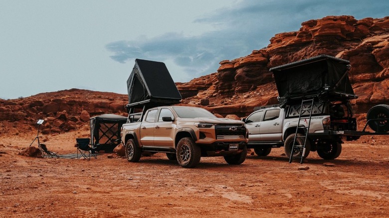 Overlanding trucks with rooftop tents set up