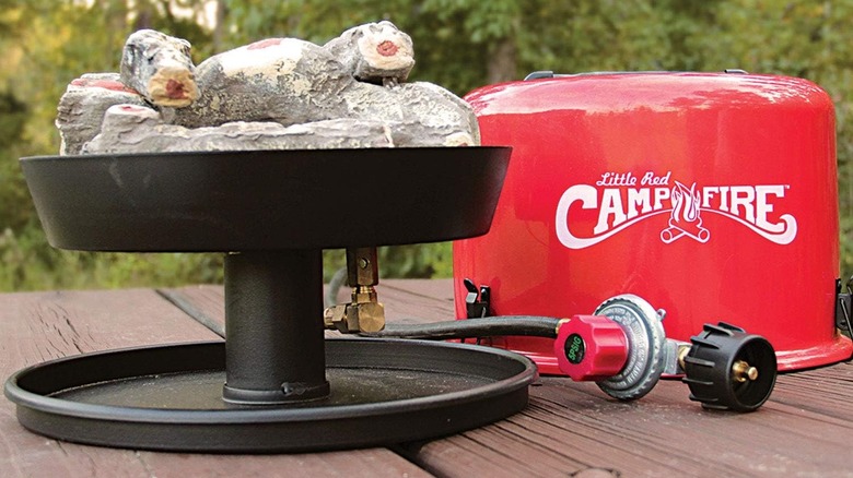 Camco Little Red Campfire on table