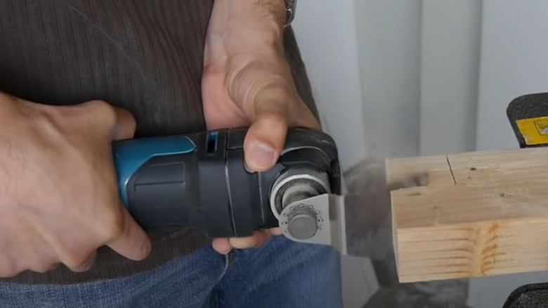 Makita oscillating tool cutting wood