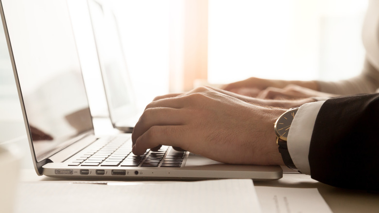 man using a macbook