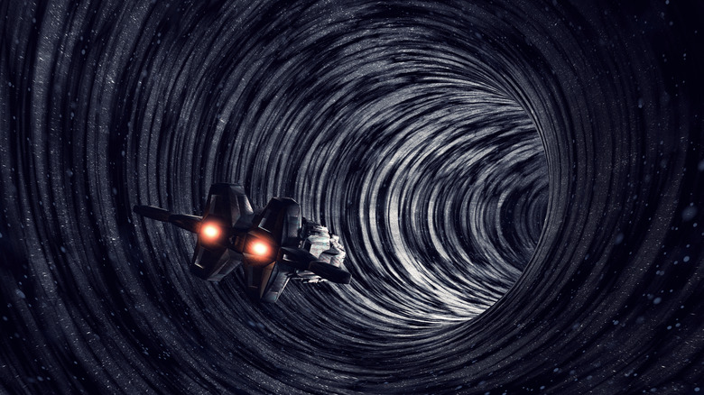 artistic interpretation of spaceship going into a wormhole