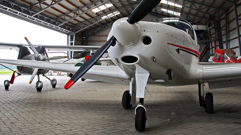 Small planes in hangar