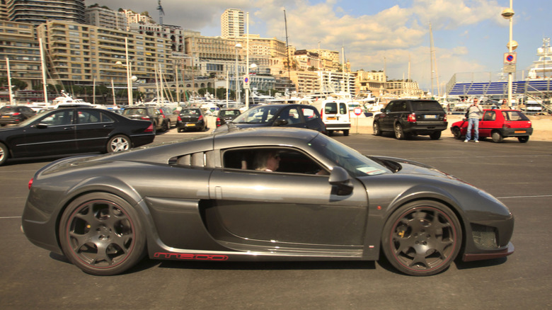 Silver Noble M600 in city parking lot