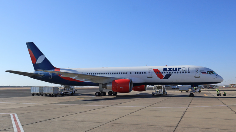 An Azur Air Boeing 757 sits on airport tarmac