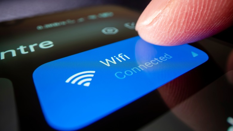 Person connecting to Wi-Fi on phone