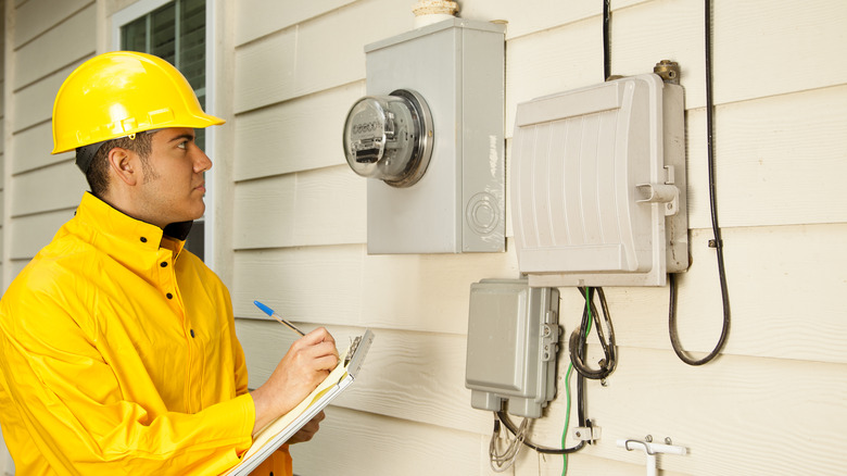 Electrician inspecting meter