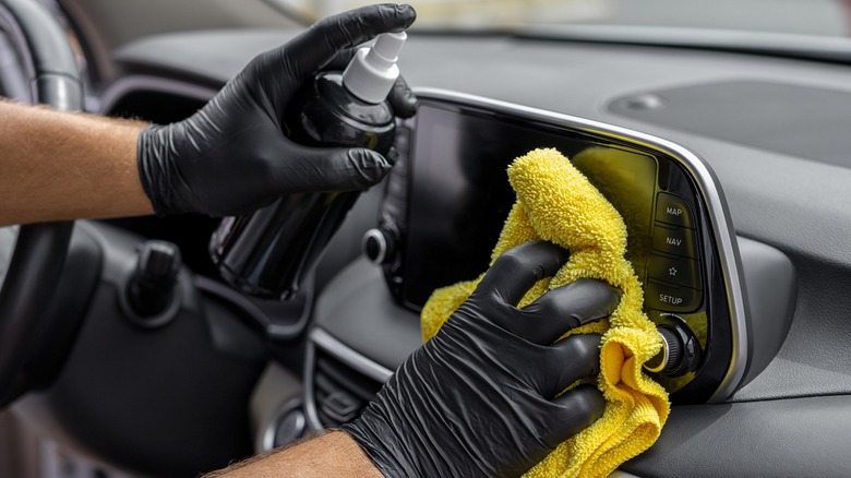 Close up of person wiping car