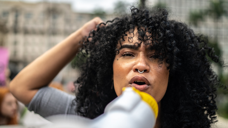 woman shouting into megaphone