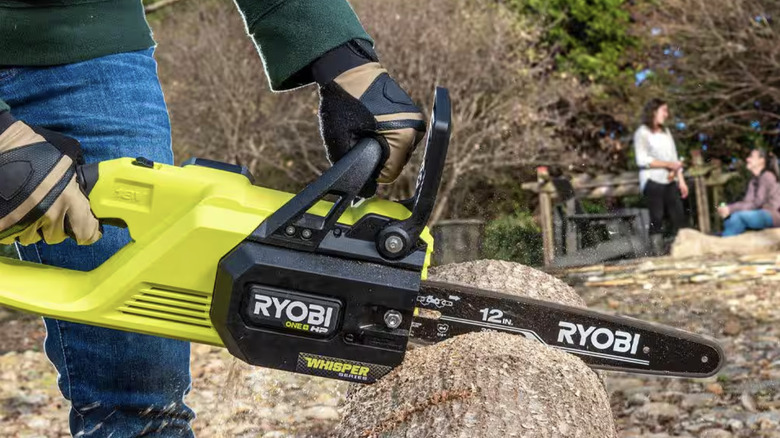 Chainsaw cutting through wood