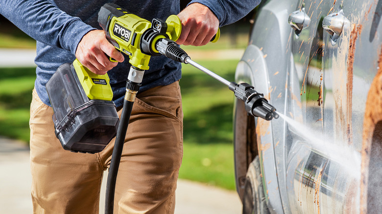 person using Ryobi power cleaner