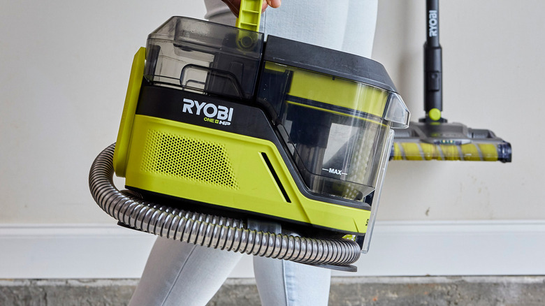 person carrying Ryobi Swiftclean