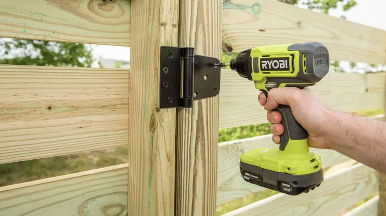 Ryobi drill used on gate hinge