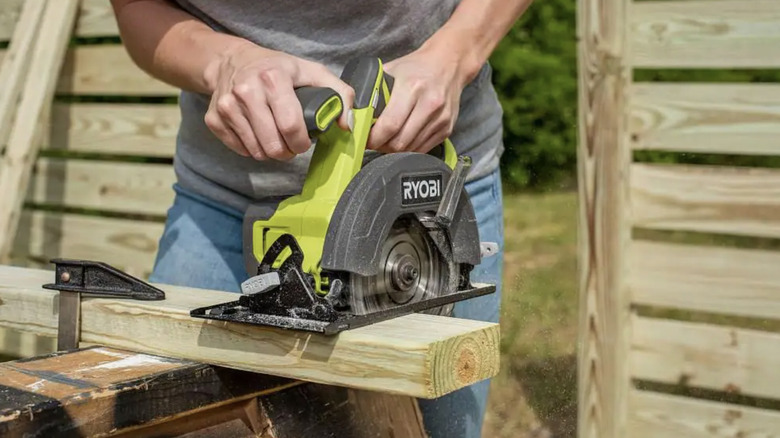 a circular saw cutting wood