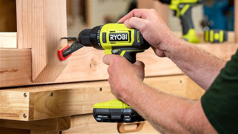 Person using Ryobi drill