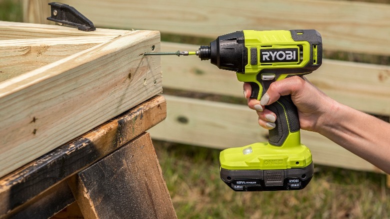 Person using a Ryobi 18V One+ ¼-inch Impact Driver