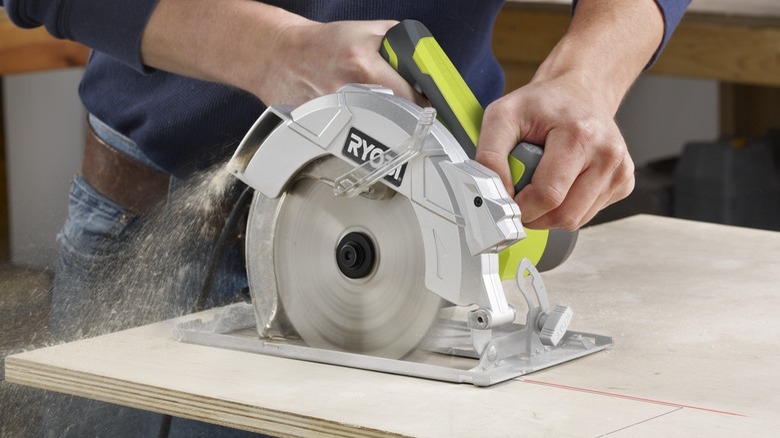 Person using Ryobi 7¼-inch Circular Saw