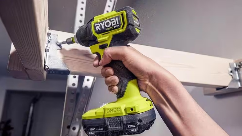 Hand using Ryobi impact driver