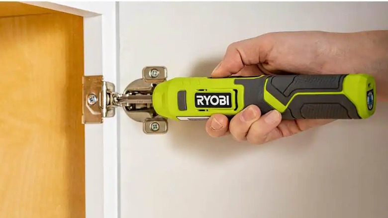 Hand attaching hinge with Ryobi cordless screwdriver