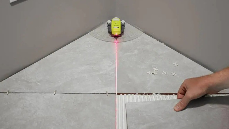 Ryobi laser level on floor tile