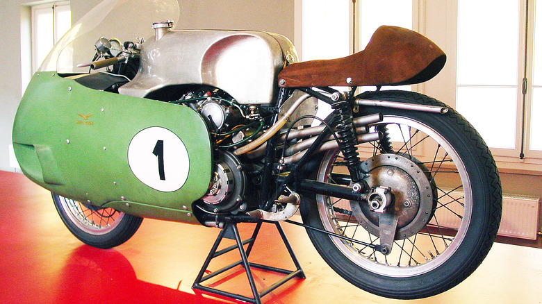 Moto Guzzi V8-powered racing bike with No. 1 on display stand